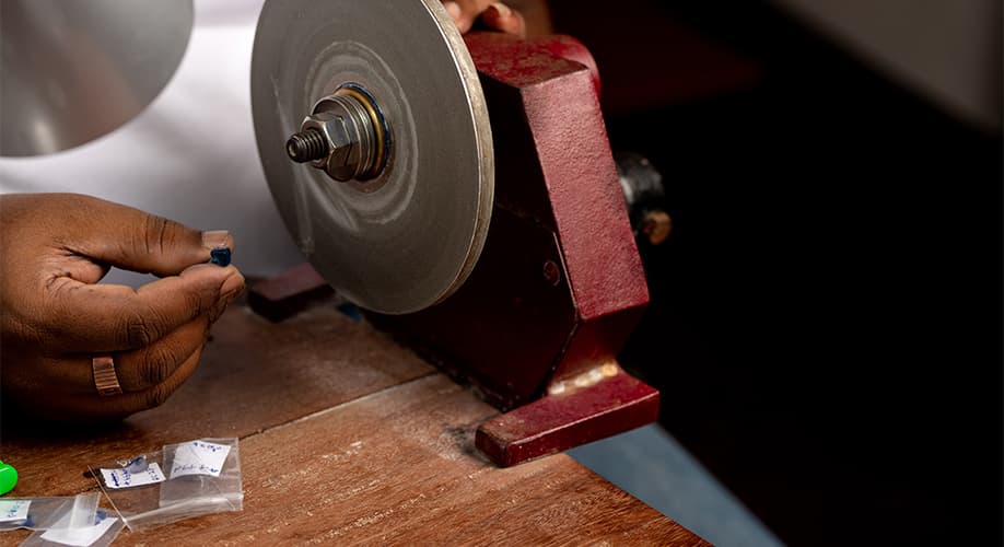 A finished Ceylon sapphire being examined at the grading table
